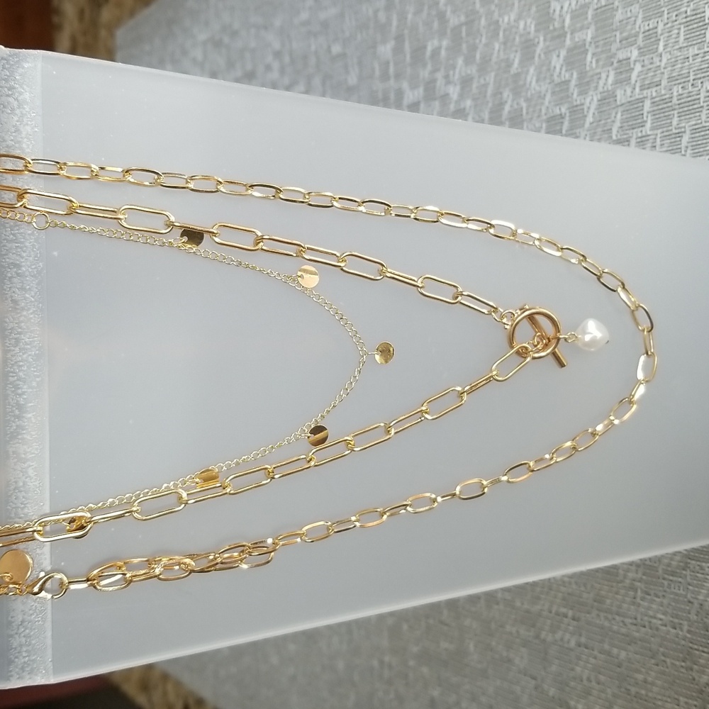 3 separate gold tone necklaces